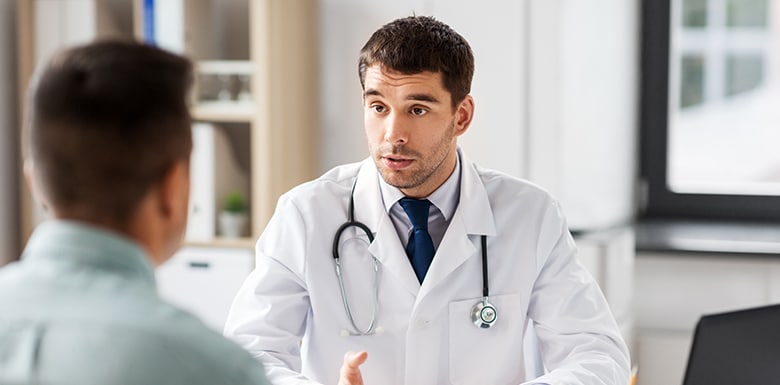 Doctor talking to his patient seriously